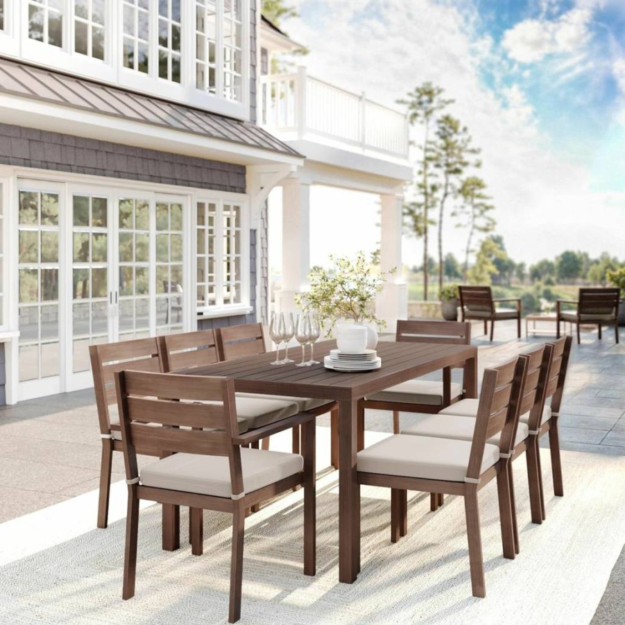 Martha Stewart Bedford 9-Piece Outdoor Patio Dining Set with 71-Inch Table & 8 Stackable Chairs, Brown Woodgrain Aluminum Frame & Cream All-Weather Cushions